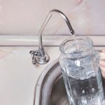 Pouring,Filtered,Water,Into,Glass,Jug,From,Water,Filter.,Closeup